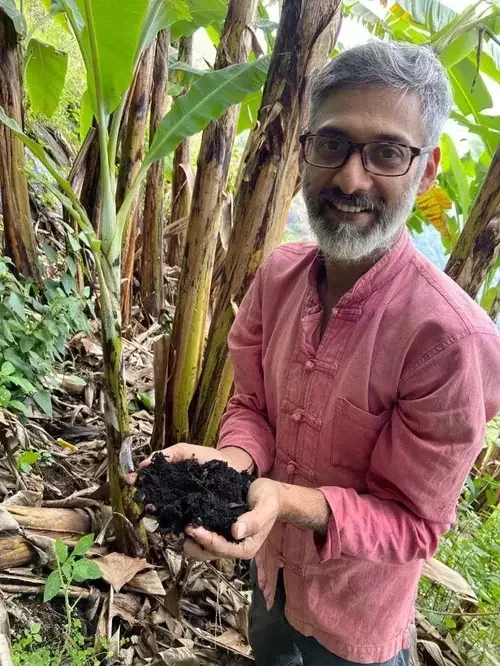 Vinay, the host of Shanti Farms, explaining the sustainable philosophy and nature-based experiences offered.